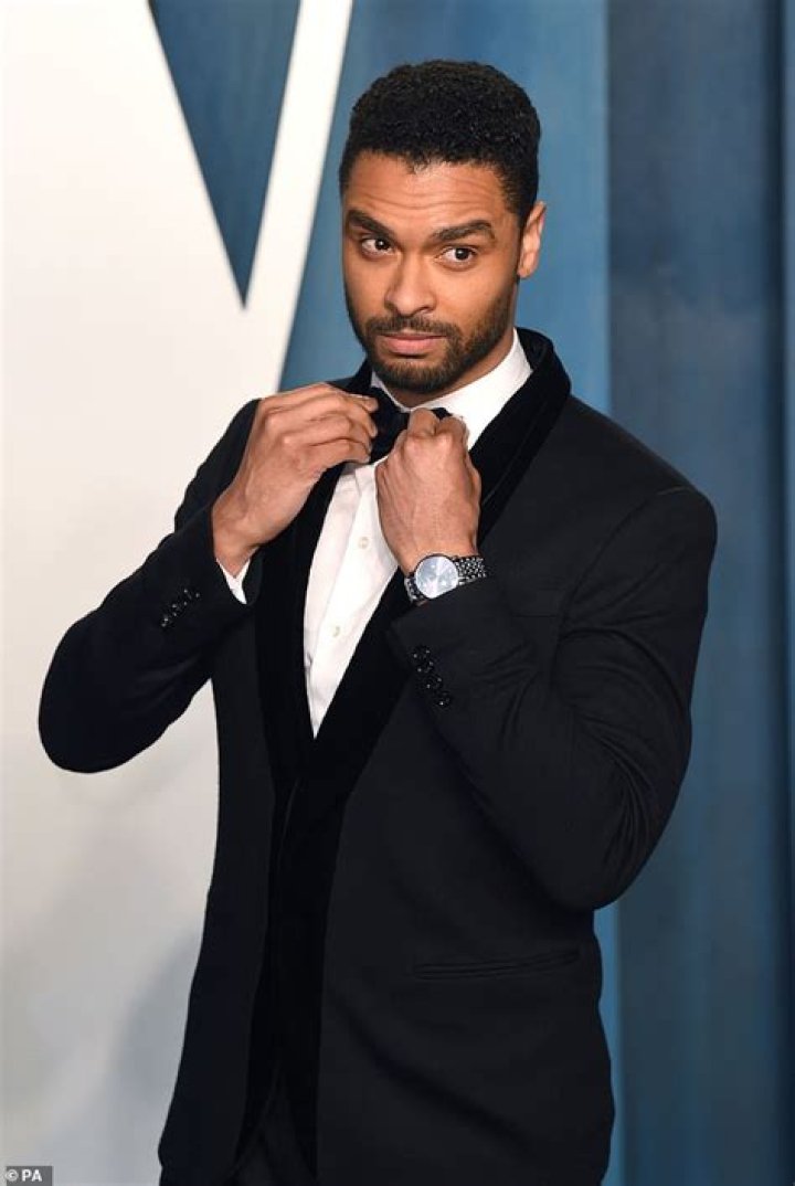 Handsome: Rege-Jean Page looked typically handsome as he arrived, wearing a bright pink shirt underneath a black jacket and fitted black trousers